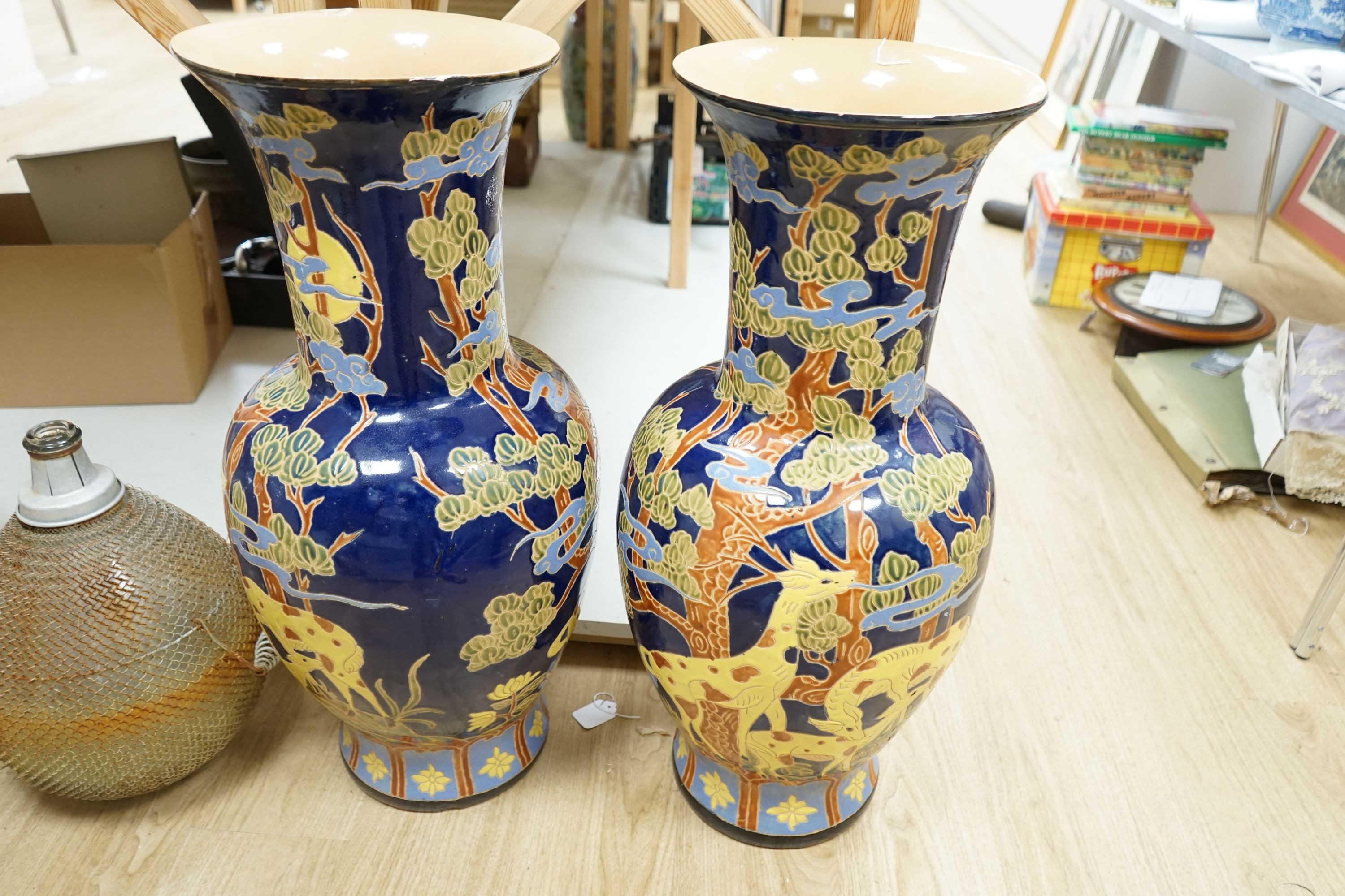 A pair of large Chinese polychrome pottery baluster vases, 82 cm